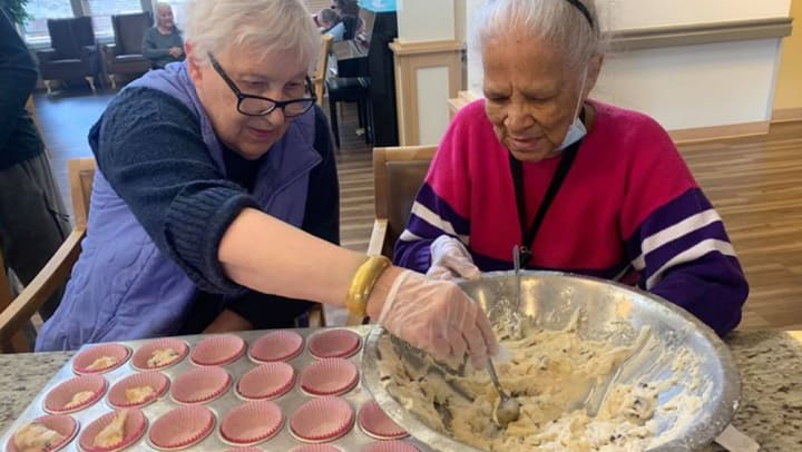 Chelsea Place Memory Care baking cupcakes