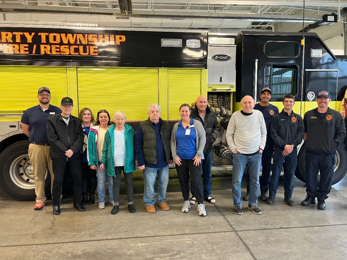 Residents with local firemen at Liberty Place