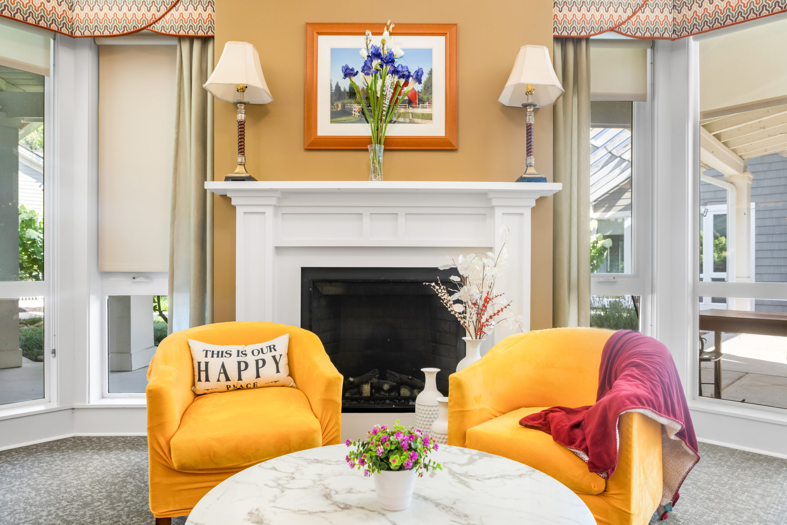 Chairs in front of fire place