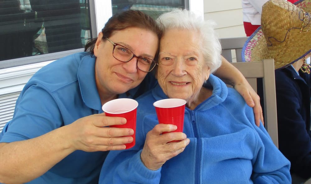 A resident and staff member hanging out at Grace Point Place in Oak Lawn, Illinois.