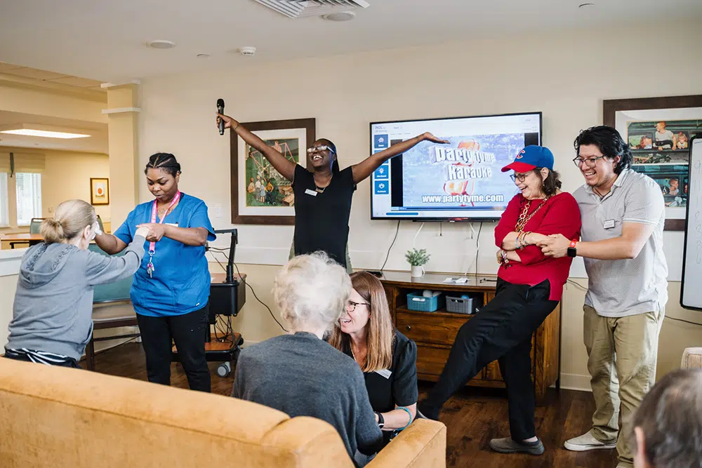 Residents and staff singing Karaoke