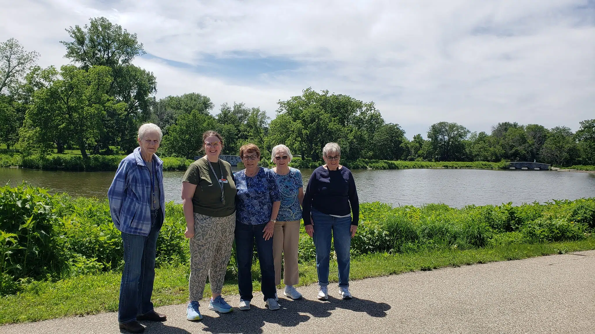Cascade Creek residents walking around the lake