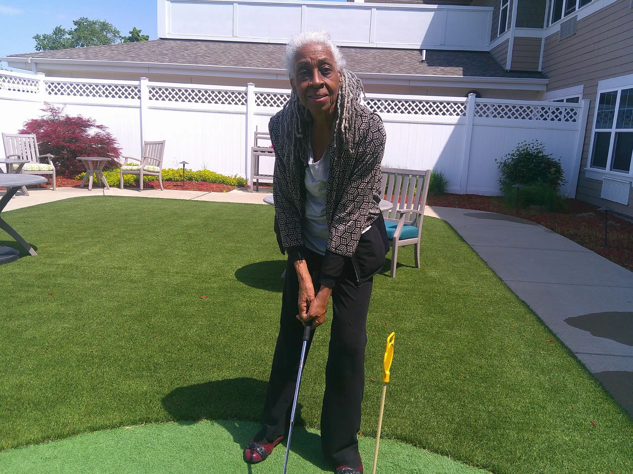 Grace Point Place resident golfing