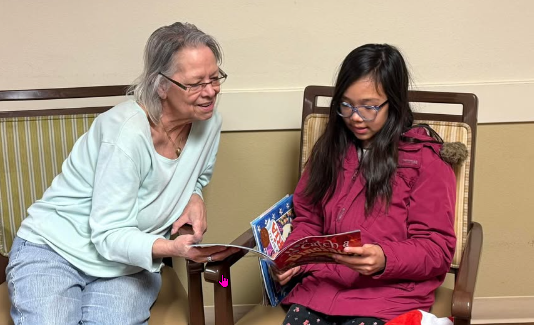 Vineyard Place Memory Care resident reads with local fourth grader from Cole Elementary School