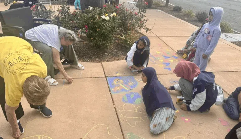 Students chalk the walk at Churchill Place Memory Care