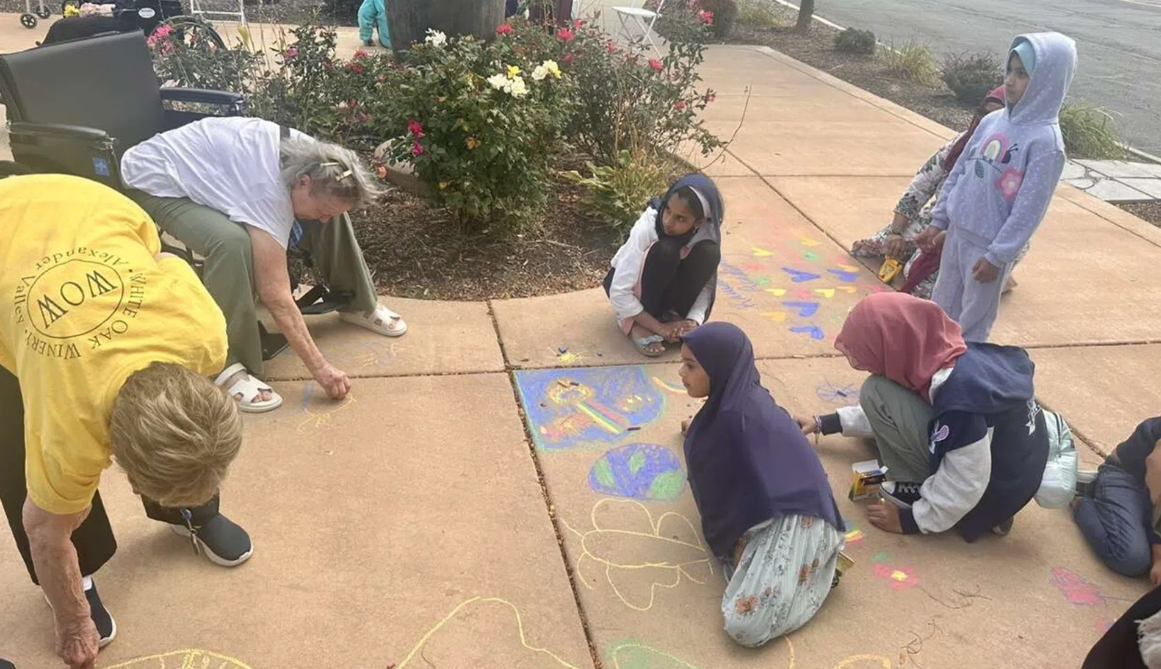 Students chalk the walk at Churchill Place Memory Care