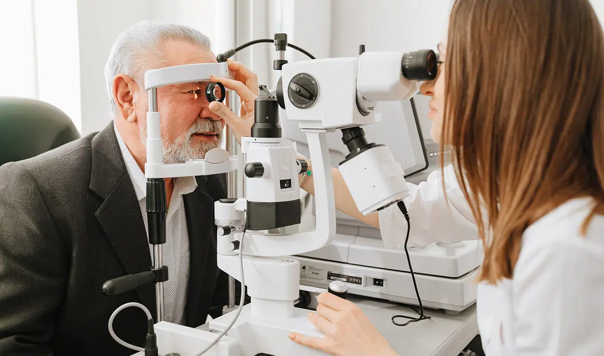 An elderly man with dementia gets a vision exam