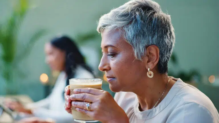 An older woman shows concern that she may be at risk for dementia along with her family