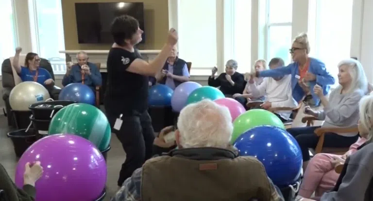 Residents of Clear Creek Memory Care in Fayetteville Arkansas enjoy a drumming session