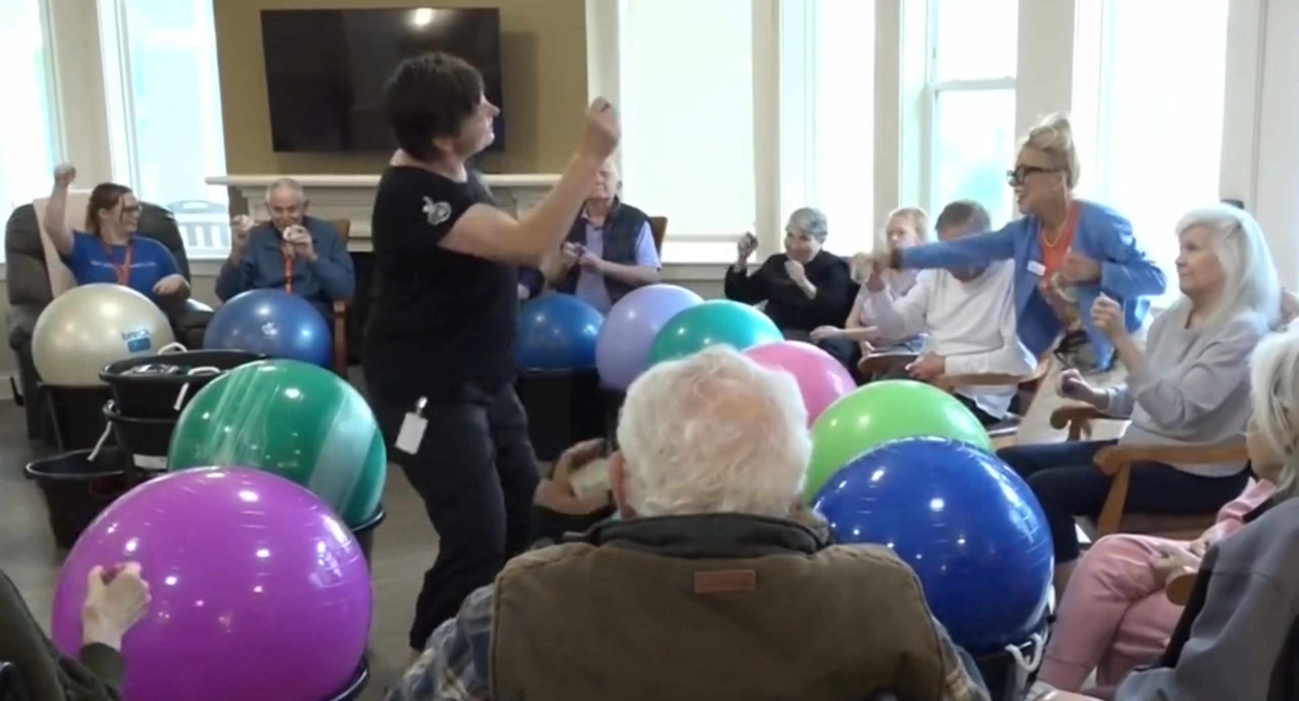 Residents of Clear Creek Memory Care in Fayetteville Arkansas enjoy a drumming session