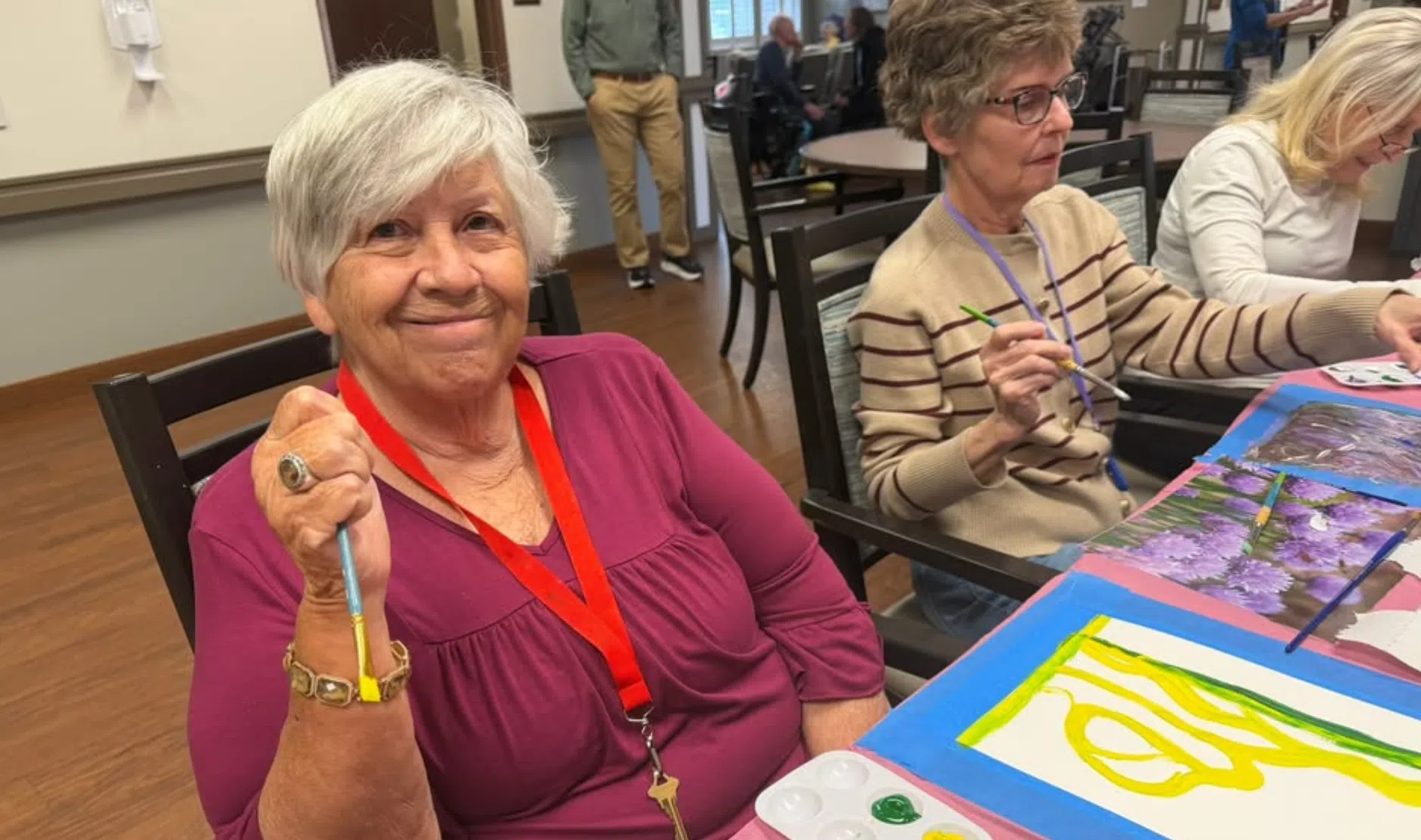 Highline Place Memory Care resident enjoys an art project
