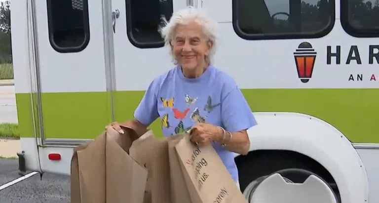 Harvester Place Memory Care resident brings bags of supplies to help Chicago area tornado residents