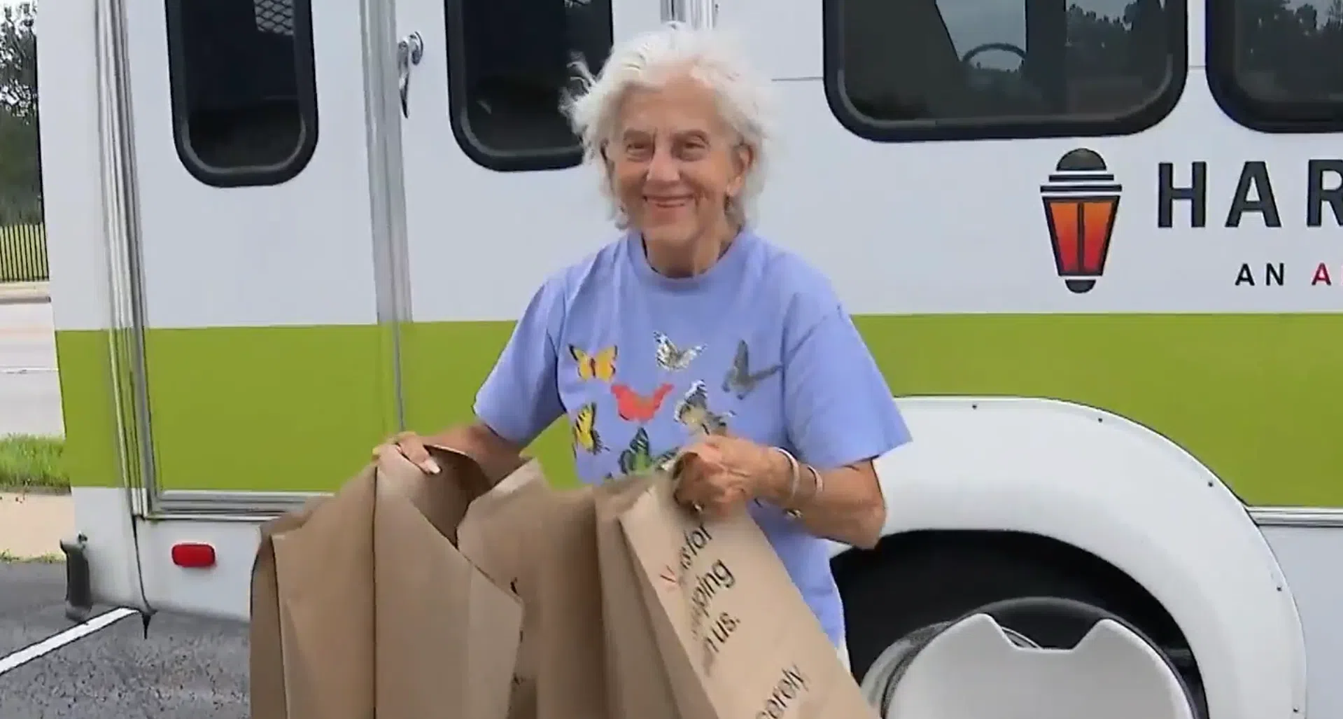 Harvester Place Memory Care resident brings bags of supplies to help Chicago area tornado residents