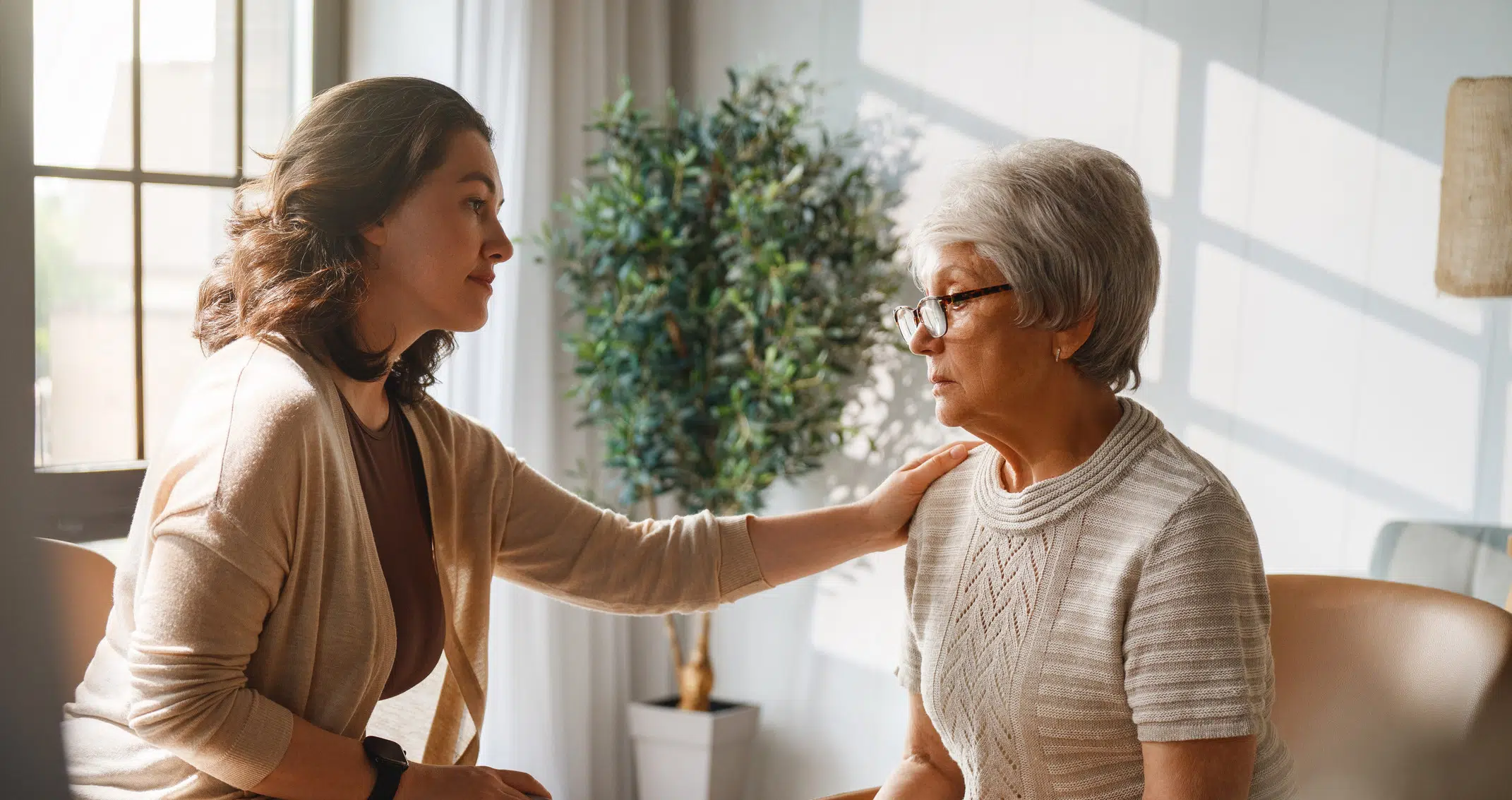 And adult child comforts her mom who is living with dementia